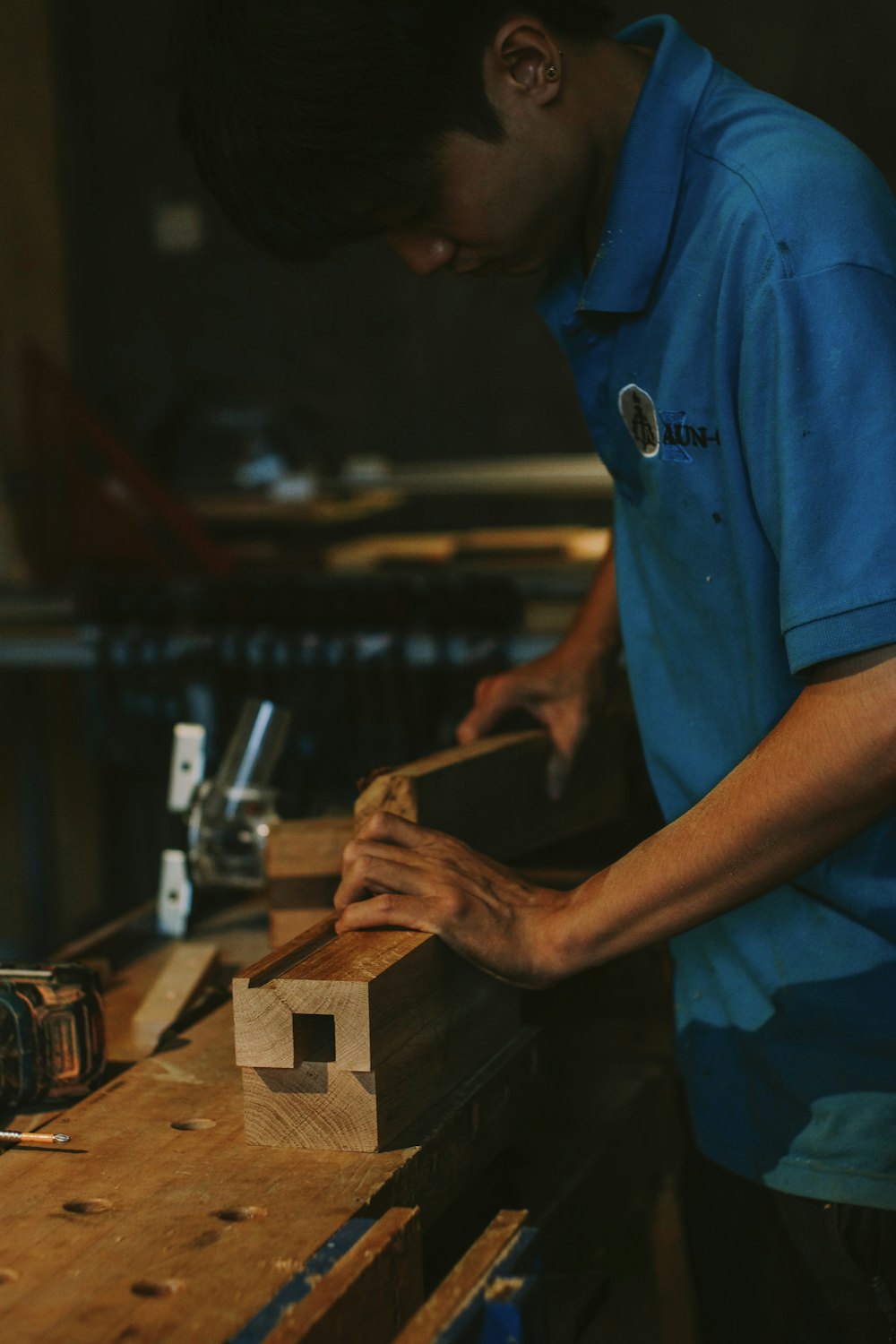 Carpenter working with wood at a workbench